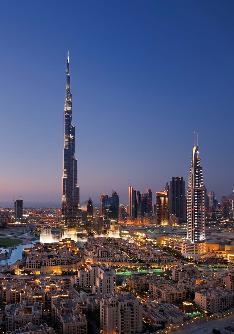 Illuminated Burj Khalifa and Dubai skyline at dusk